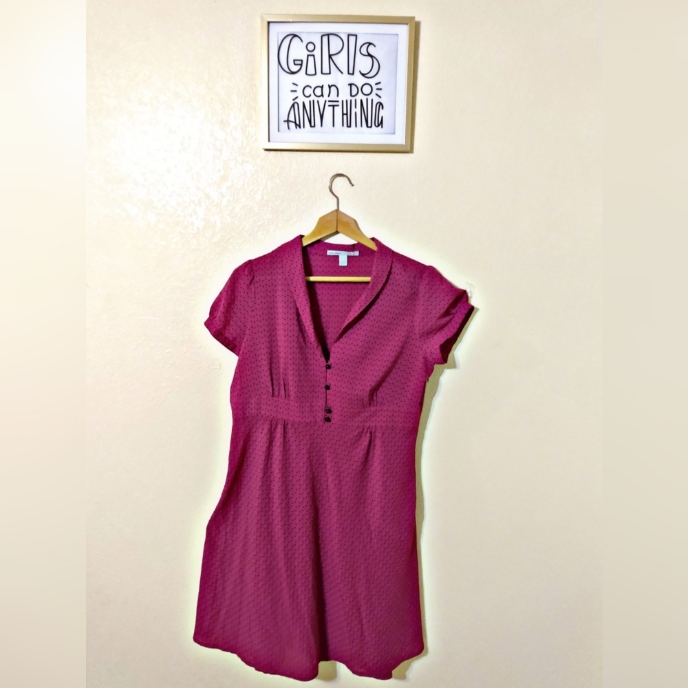 Pink dress with black dots.